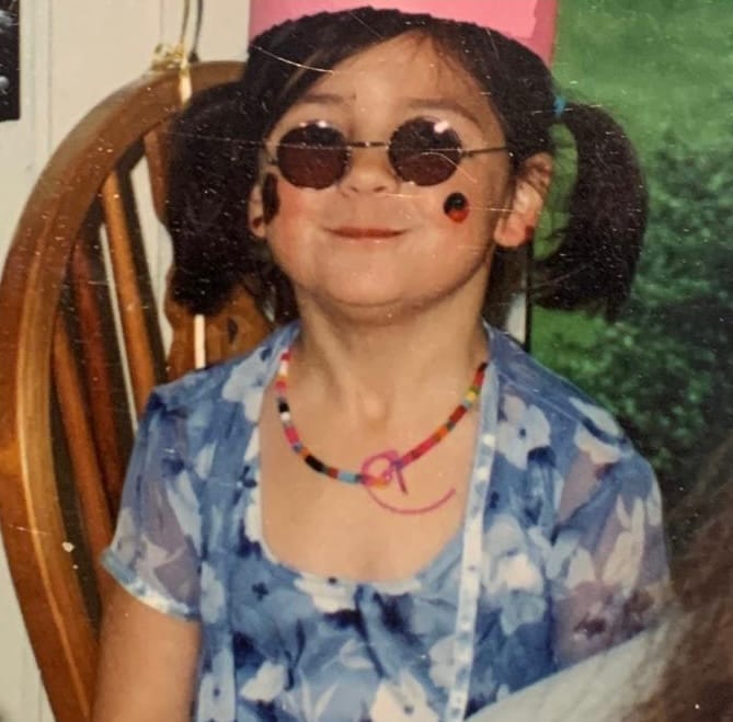 Portrait of a young Sarah, writer and founder of Soft Cuts newsletter